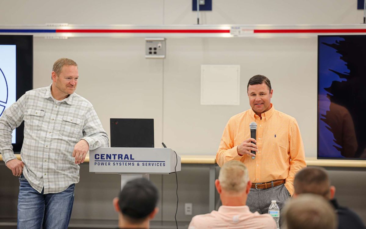 Kyle Kennedy, the new Central Power Systems and Services COO standing alongside the CEO, Robin Roberts addressing employees.